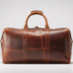 High-quality full-grain leather duffle bag with a vintage aesthetic, perfect for travel.