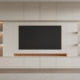 Modern living room with a stylish media wall featuring integrated shelves and a large television
