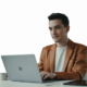 Professional content creator working on TikTok growth strategy with laptop on white background