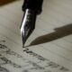 Fountain pen writing on paper, representing a writer building a personal brand